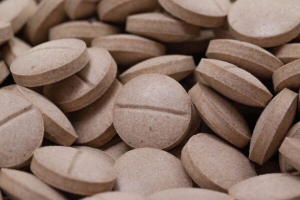 Pseudo Cherry Cola Kratom Tablets Pile Pseudo Cherry Cola Kratom Tablets Pile